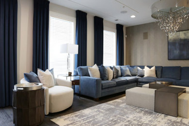 Family room - large transitional medium tone wood floor, brown floor and wallpaper family room idea in DC Metro with a media wall