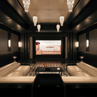 Example of a large classic enclosed multicolored floor home theater design in Dusseldorf with black walls and a projector screen