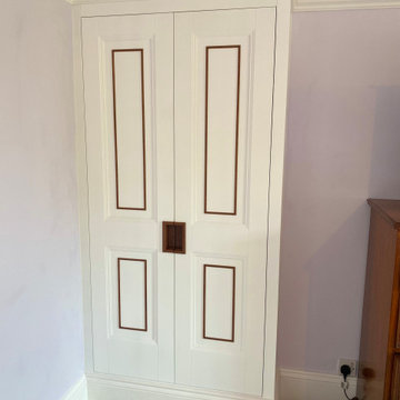 Bespoke Fitted Wardrobes with Painted Panelled Doors and Wood Inlay | Cheltenham
