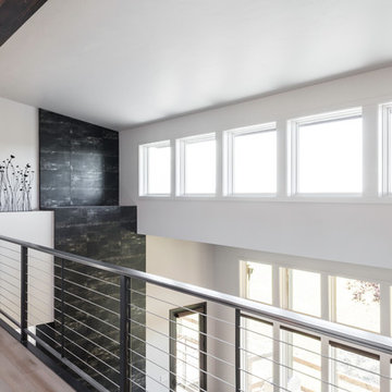 Bridge overlooking living room, with view to mountains