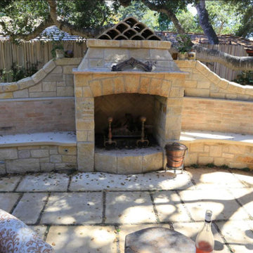 Outdoor Carmel stone fireplace with wraparound seating