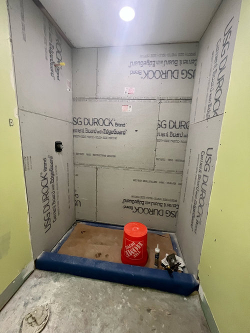 No thinset on Durock cement board for shower wall?