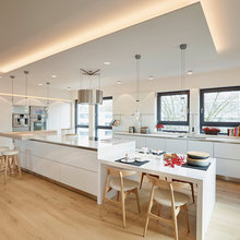 Light wood floor; white cabs
