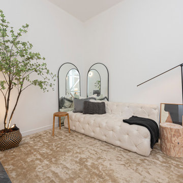Avenida do Chile living room with sofa, mirrors and indoor tree