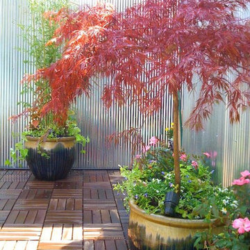 NYC Roof Garden: Terrace, Deck Tiles, Metal Fence, Contemporary Outdoor Dining