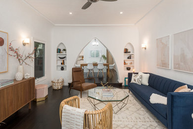 Example of a mid-sized 1950s dark wood floor and brown floor living room design in Los Angeles with white walls
