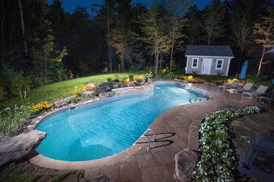 Mountain style pool photo in Other