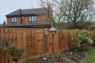 Closeboarded fence with gravelboard and capping