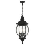 Livex Lighting - Textured Black Traditional, Colonial, French Historical, Outdoor Pendant Lantern - The classically transitional outdoor Frontenac collection boasts a cast aluminum structure with dazzling ornamental design.  The four-light large six-sided pendant lantern comes in a textured black finish with clear beveled glass and extravagantly decorative details. The ornate quality of this light will add radiance to your house exterior day or night.