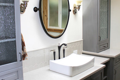 Bathroom - large transitional master gray tile and ceramic tile dark wood floor bathroom idea in Seattle with a trough sink, raised-panel cabinets, gray cabinets, quartz countertops, white walls and white countertops