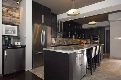 Inspiration for a small contemporary galley ceramic tile kitchen pantry remodel in Toronto with a single-bowl sink, flat-panel cabinets, dark wood cabinets, granite countertops, multicolored backsplash, stone tile backsplash, stainless steel appliances and an island