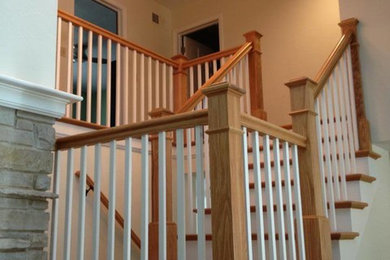 Inspiration for a mid-sized timeless wooden straight staircase remodel in Chicago with wooden risers