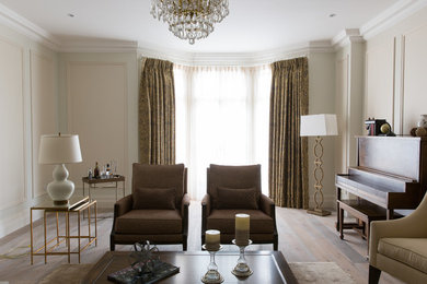 Design ideas for a large traditional formal living room in London with yellow walls, light hardwood floors and no tv.