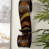 Traditional Style Scrolled Brown Metal Wall Sconces with Abstract Designs