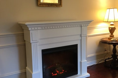 Mid-sized minimalist living room photo in Toronto with yellow walls and a standard fireplace