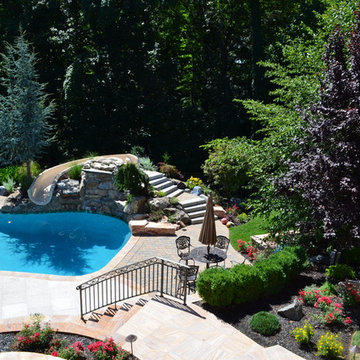 Custom Pools & Spas, Outdoor Kitchens, Patios & Walkways, and Plantings