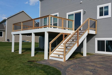 Deck - mid-sized backyard second story deck idea in Minneapolis