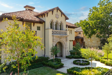 Inspiration for a mediterranean exterior home remodel in Dallas