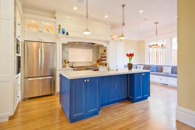 Kitchen - traditional galley kitchen idea in San Francisco with white cabinets, shaker cabinets, gray backsplash, subway tile backsplash and stainless steel appliances