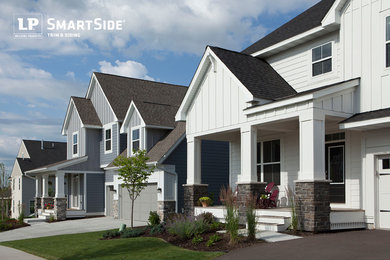 Example of an arts and crafts wood exterior home design in Minneapolis