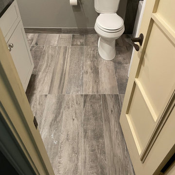 BATHROOM - New Tub, 12x24 Brown Tile, Gray Plank Floor Tile, Tebas Black Granite