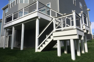 Example of a mid-sized backyard second story deck design in Baltimore with no cover