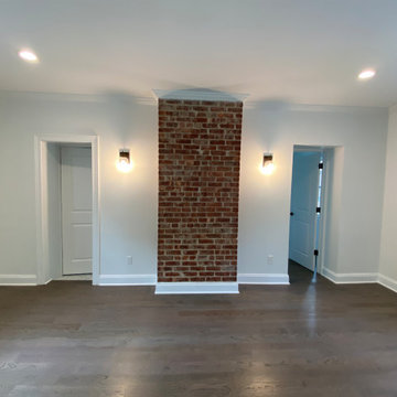 Exposed Brick Chimney with Wall Sconces