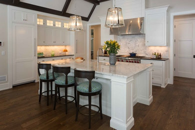 Design ideas for a large transitional l-shaped eat-in kitchen in San Diego with a farmhouse sink, shaker cabinets, white cabinets, quartzite benchtops, white splashback, subway tile splashback, stainless steel appliances, medium hardwood floors and with island.
