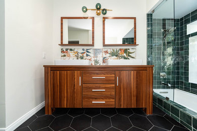 Example of a mid-sized eclectic master green tile and porcelain tile porcelain tile, black floor and double-sink bathroom design in Los Angeles with flat-panel cabinets, medium tone wood cabinets, a one-piece toilet, white walls, a vessel sink, wood countertops and a freestanding vanity