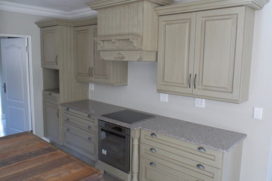 Kitchen - country kitchen idea in Other