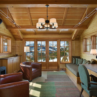 Design ideas for a large modern study in Other with a wood burning stove, a built-in desk, beige walls and dark hardwood flooring.