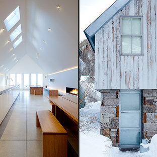 デンバーの中サイズのコンテンポラリースタイルのLDKの画像 (白い壁、コンクリートの床)