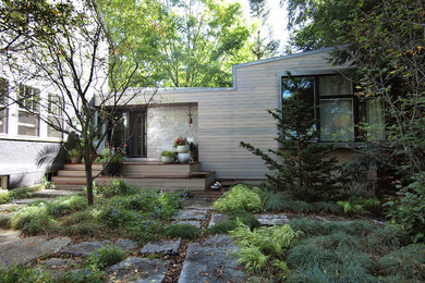 Minimalist gray one-story mixed siding exterior home photo in New York