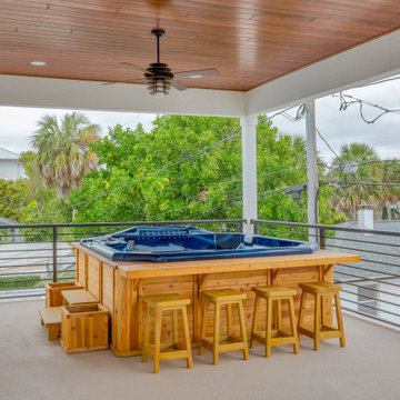 Stylish Outdoor Living Space With Covered Balcony and Relaxation Bar