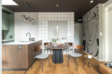 Example of a mid-sized trendy open concept light wood floor living room design in Vancouver with white walls and no tv