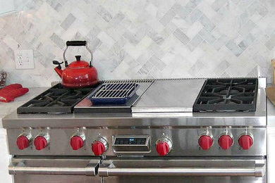 Inspiration for a large transitional kitchen remodel in Bridgeport with white backsplash and stainless steel appliances