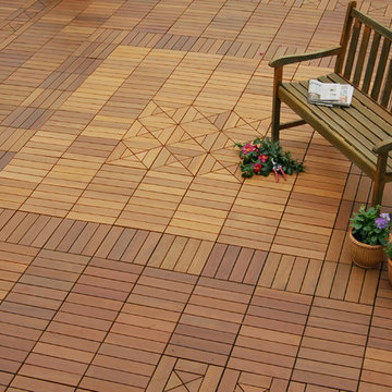 Ipe wood deck tiles covering a drab asphalt surface on a garage roof
