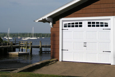 Mid-sized arts and crafts attached two-car garage photo in Kansas City