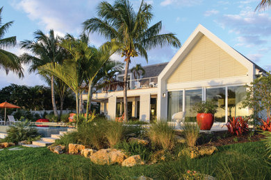 Example of an island style one-story house exterior design in Miami