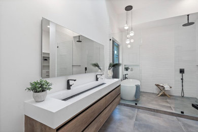 Example of a large trendy master gray floor and single-sink freestanding bathtub design in Other with flat-panel cabinets, brown cabinets, white walls and a floating vanity