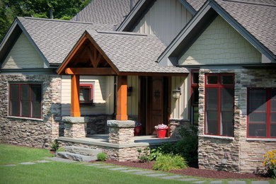 Mid-sized craftsman beige one-story mixed siding gable roof idea in Other