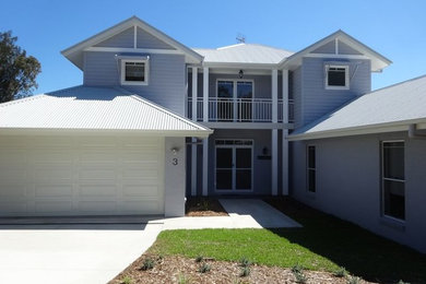This is an example of a beach style home design in Central Coast.