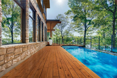 Mid-sized trendy side yard pool photo in Other