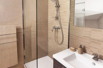 Photo of a traditional 3/4 bathroom in Paris with a corner shower, beige tile and tile benchtops.
