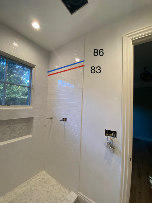 what height should shower glass be for 9’ ceiling?