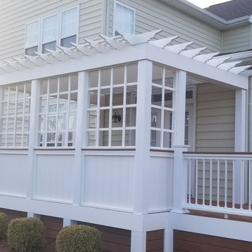 Wraparound Deck with cool detailed trellis with faux window panes