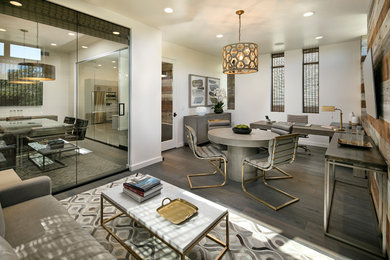 Home studio - mid-sized contemporary freestanding desk medium tone wood floor and gray floor home studio idea in Los Angeles with white walls