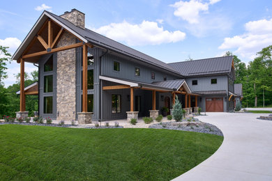 Example of a farmhouse exterior home design in Grand Rapids