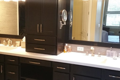 Inspiration for a mid-sized contemporary master porcelain tile bathroom remodel in Other with shaker cabinets, dark wood cabinets, a two-piece toilet, beige walls, an undermount sink and quartz countertops