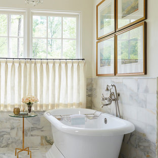 Inspiration for a timeless master multicolored tile multicolored floor freestanding bathtub remodel in Atlanta with yellow walls